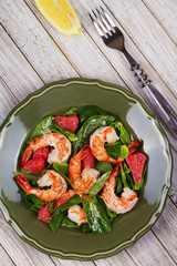 Shrimp, grapefruit and spinach salad. View from above, top studio shot