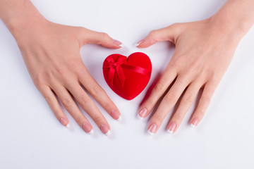 Classic French manicure with beautiful red heart.