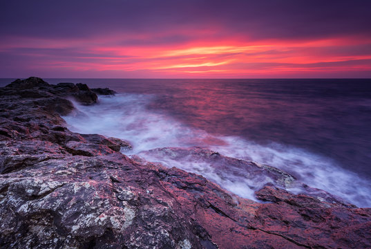 Fototapeta Rocky sunrise. Magnificent sunrise view in the blue hour at the Black sea coast, Bulgaria.