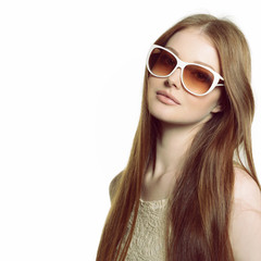 Girl in sunglasses. Beautiful woman in sunglasses posing in stud