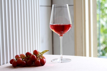 Rosé Wine with grape fruit in selective focus