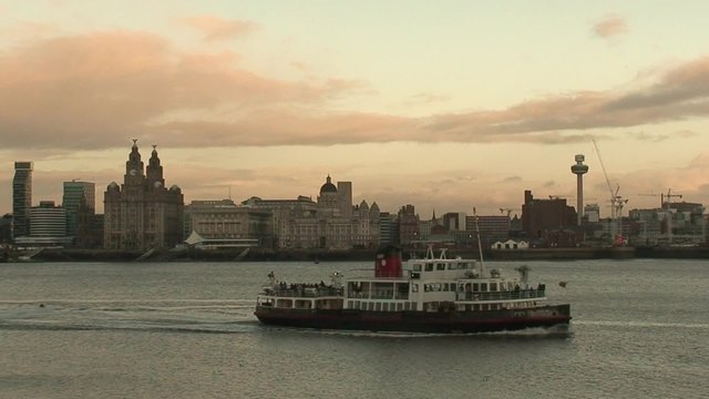 Liverpool's historic waterfront with the mersey ferry passing 