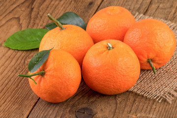 Tangerines Mandarins Fruits over Wood