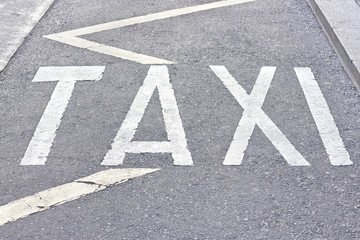 Taxi sign on the ground
