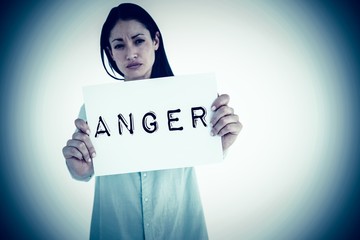 Composite image of sad woman showing sign