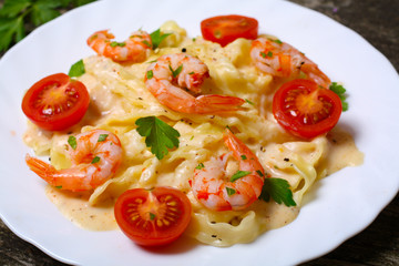 pasta with shrimp, tomatoes, herbs and cream sauce