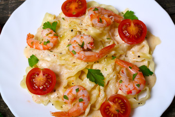 pasta with shrimp, tomatoes, herbs and cream sauce