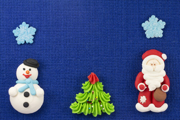 Christmas figurines sweet mastic on a blue background
