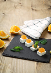 Snack cheese with quince and fresh oranges