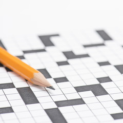Crossword puzzle and pen