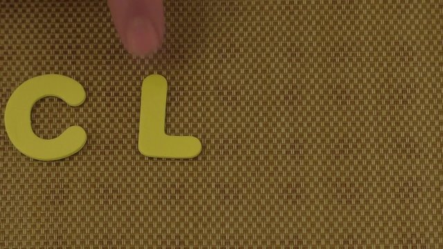 Woman hand writes the word CLUB
