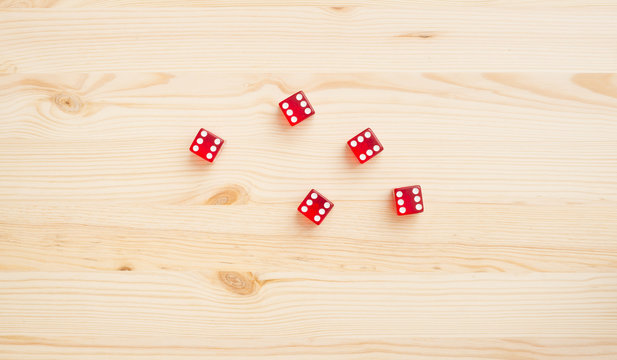 Red Casino Dice On Wooden Background