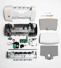 Disassembled printer on a white background