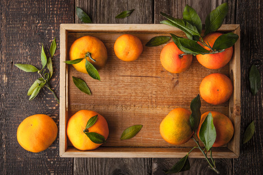 Tangerines on the wooden tray