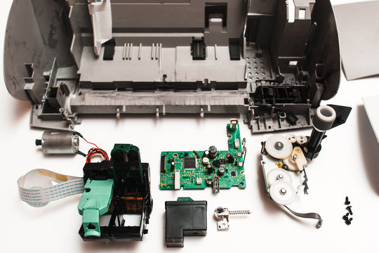 a printer machine with a printer and a printer - parts of the broken ink jet printer on white backgr