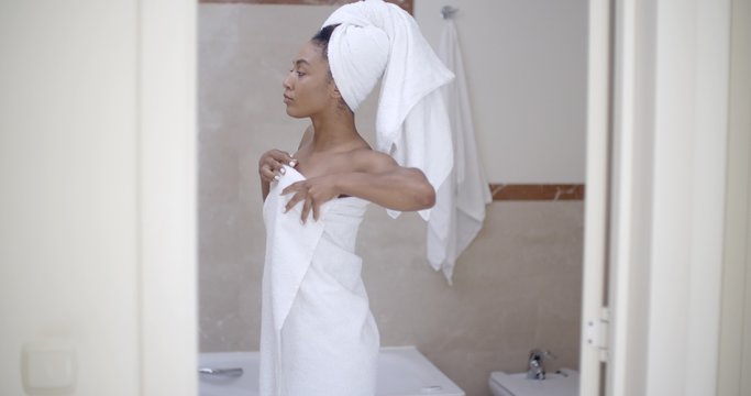 Woman With Towel On Head In The Bathroom
