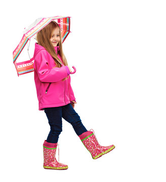 Portrait of girl child wearing pink clothes with umbrella.