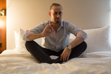 Fototapeta premium Man on the bed