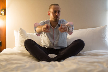 Fototapeta premium Man on the bed