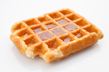 waffles with honey isolated on white