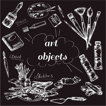 hand drawn set brushes and art object on black board