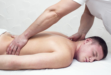 man doing sports massage at the massage parlor