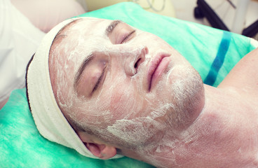 man in the mask cosmetic procedure in spa salon