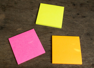 Colorful post it note on wood board