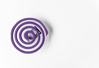 Purple mosquito coil on white background