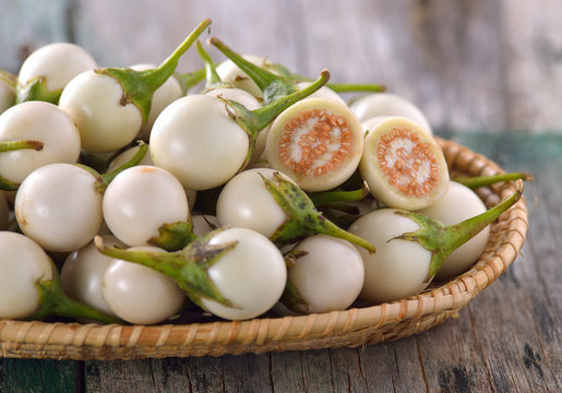 white eggplant on wooden table