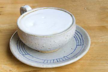 Close up Vintage cup of Coffee, latte on wooden background
