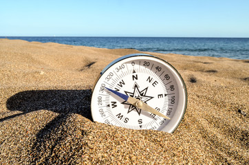 Compass on the Sand Beach