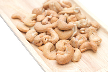 Cashew nuts in the wooden tray.