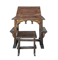 Old weathered wooden prayer desk with stool