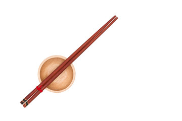 Top view : wooden chopsticks placed on the wooden cup.
