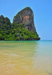 Obraz premium Paradise tropical sand sea beach with rock