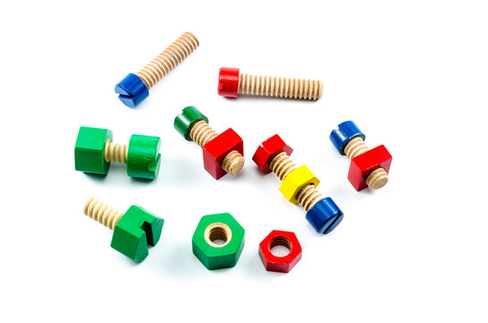 Colorful wooden nuts and bolts toy isolated on white background