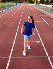 Fototapeta premium Little girl have fun on the stadium