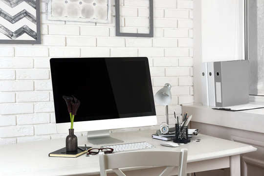 Stylish workplace with computer in home or office