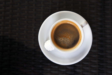 Cup of tasty coffee with zephyr in cafe