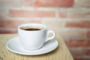 Cup of tasty coffee on cafe background
