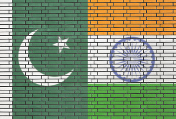 Pakistan and India flags on a wall