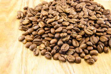 Coffee beans on vintage wooden board