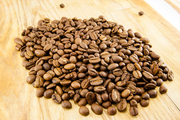 Coffee beans on vintage wooden board