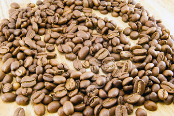 Coffee beans on vintage wooden board
