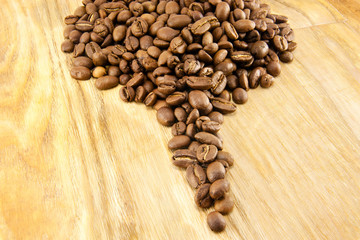 Coffee beans on vintage wooden board