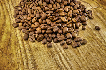 Coffee beans on vintage wooden board