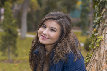 portrait of a young woman in a jacket with fur