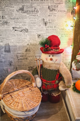 Wreath with snowman sitting on it with text Merry Christmas 