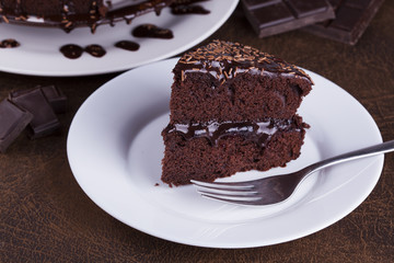 Fototapeta na wymiar Luxurious Rich Chocolate Cake on White Plate